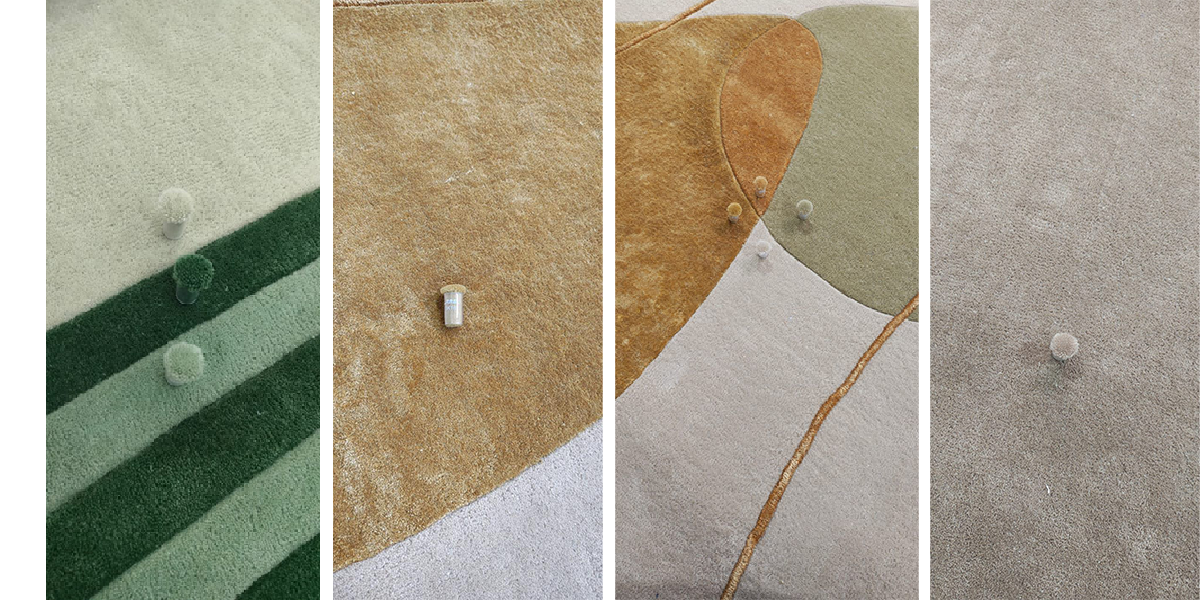 Inspecting the final colors of the rug with the approved color codes.